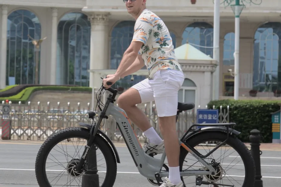 Rider on the Shengmilo MX06PRO Electric Bike cruising along a city road, emphasizing the bike’s versatility, comfortable ride, and modern features suited for daily commuting.