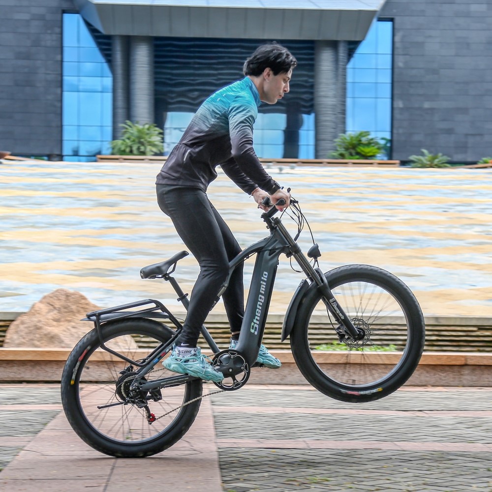 Model riding the Shengmilo MX05 Electric Bike along a dedicated bike path, demonstrating the bike’s excellent performance, smooth suspension, and power for long city rides.