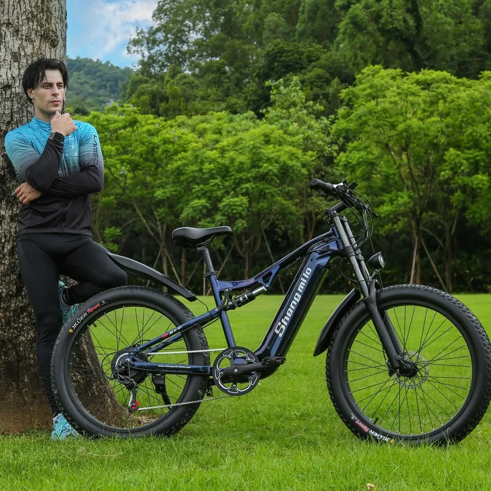 Rider on the Shengmilo MX05 Electric Bike approaching a city crosswalk, highlighting the bike’s quiet performance, easy maneuverability, and safety features for urban environments.