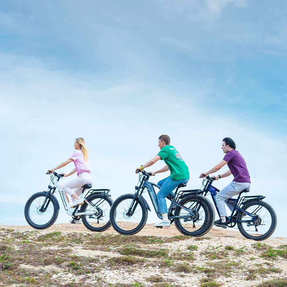 Model riding the Shengmilo MX05 Electric Bike across a mountain ridge, demonstrating its robust design and high-performance motor, perfect for all-terrain adventures.