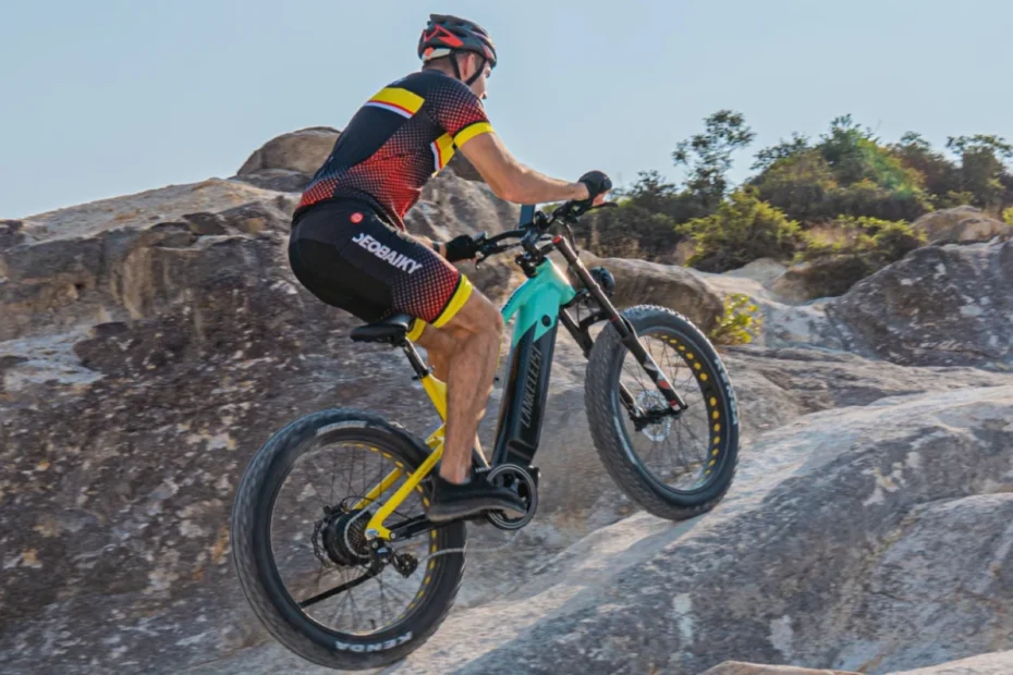 Shengmilo electric mountain bike riding on rugged off-road terrain